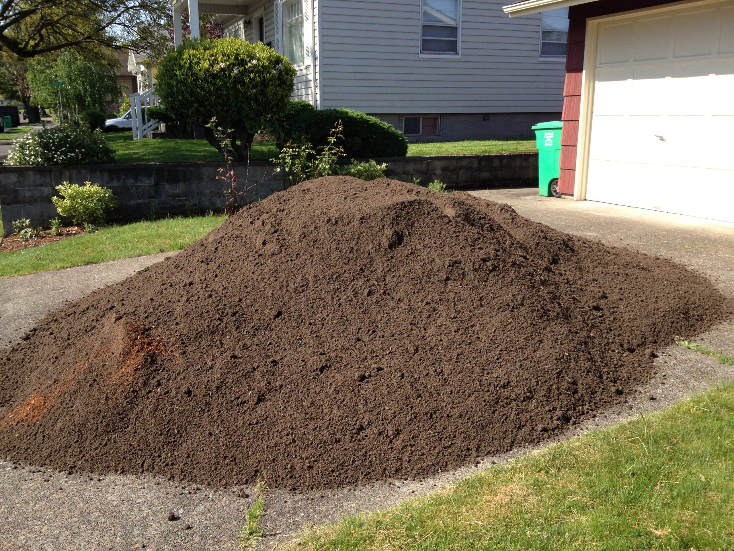 Orange-brown clay soil pile., This was a huge pile of soil …